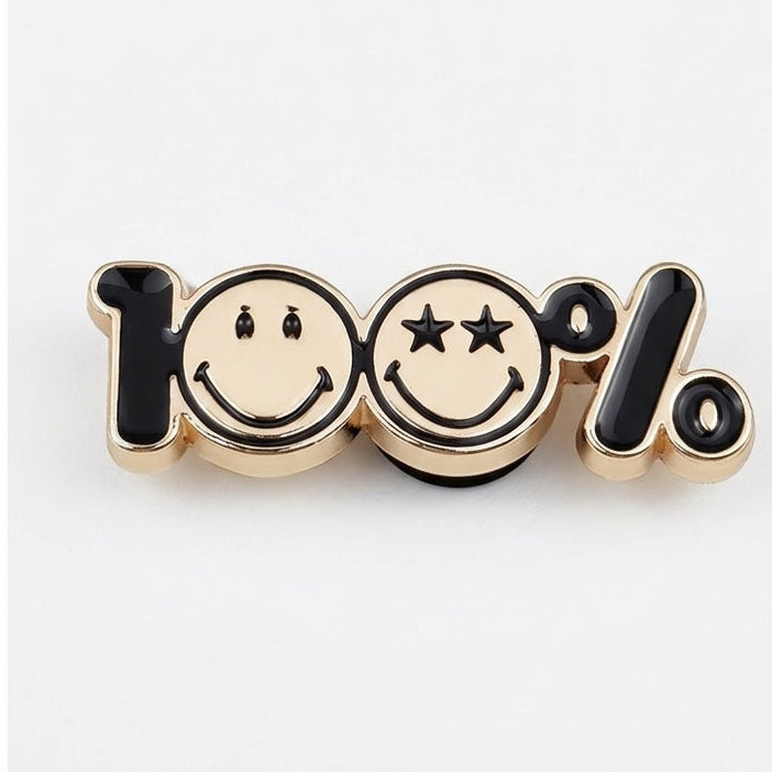 Metallic pin with smiley faces and '100%' text on a white background