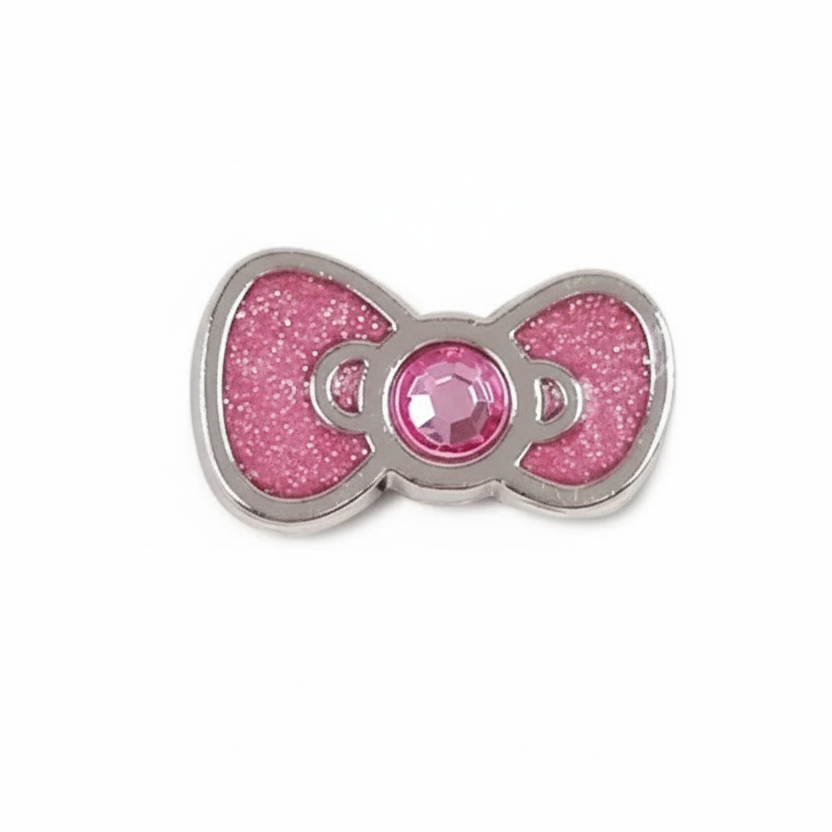 Pink glittery bow charm with a central gem on a white background