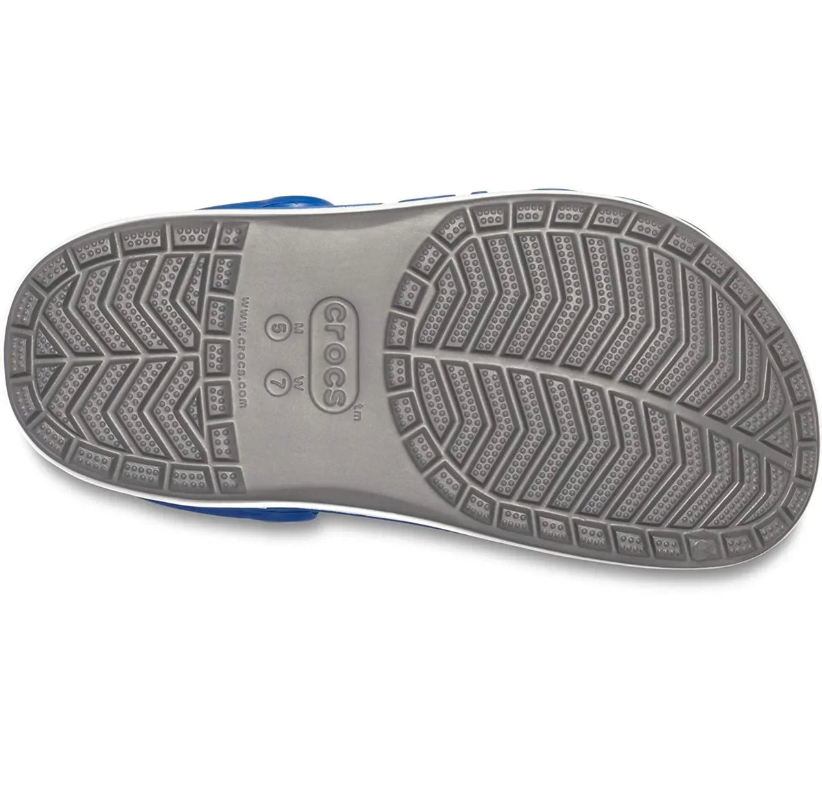 Gray rubber sole of a sandal featuring non-slip tread pattern and branding details