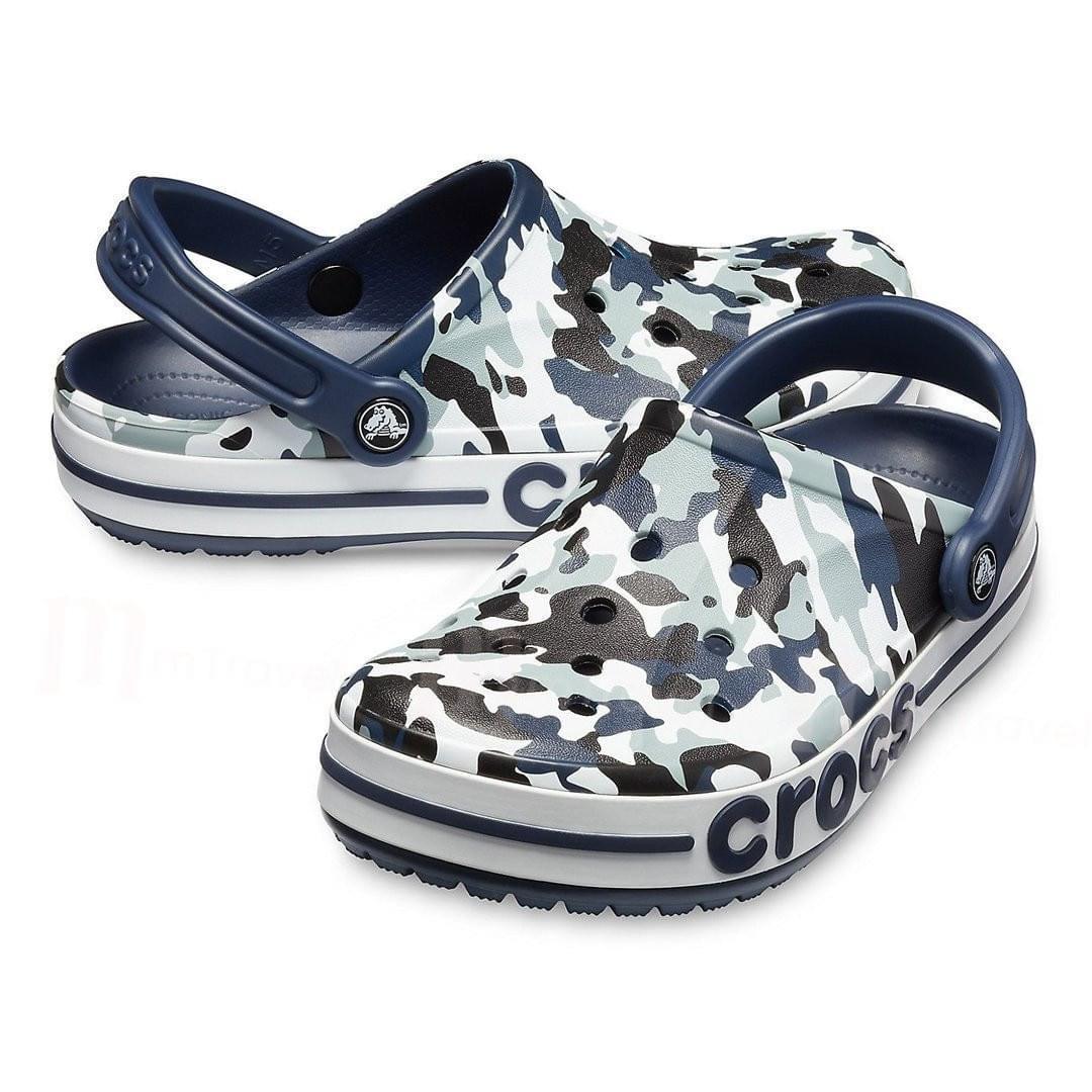Blue camo slip-on clogs with ventilation holes and navy heel straps, casual footwear