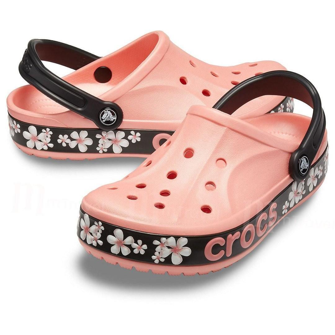 Melon pink floral graphic clogs with ventilated holes and black straps, casual footwear
